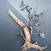 sculpture fer forger branche et feuilles sur bois flotter auvergne rhone alpes cantal